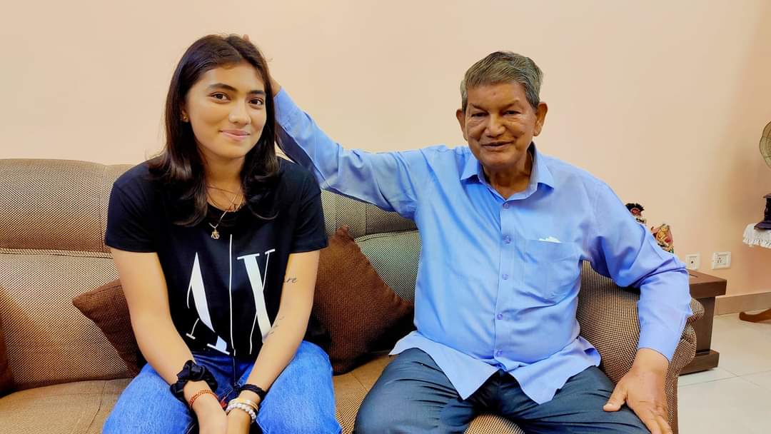 Former CM Harish Rawat with cricketer Raghavi Bisht