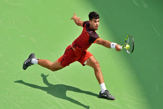 Carlos Alcaraz of Spain plays a backhand during his match against Gael Monfils of France during Day 6 of the Cincinnati Open at the Lindner Family Tennis Center on August 16, 2024 in Mason, Ohio.