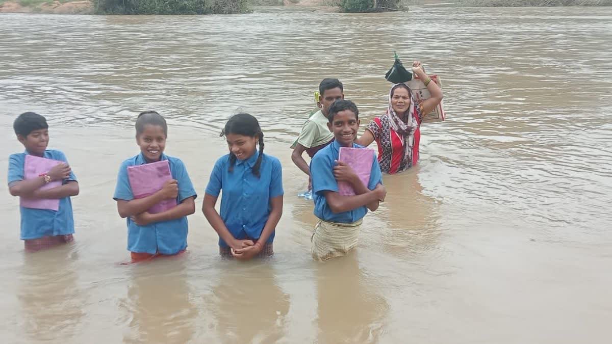 Children Cross Swollen River in Kanker