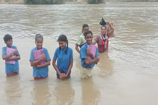 Children Cross Swollen River in Kanker