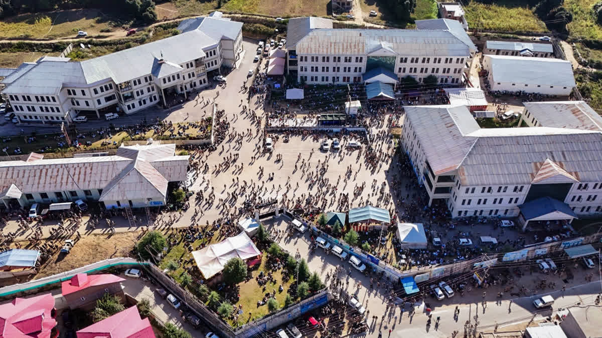 An aerial view of a distribution centre as Polling officials and Security personnel gather before leaving for their respective polling stations ahead of the first phase of the Jammu and Kashmir Assembly elections, in Kishtwar on Tuesday.