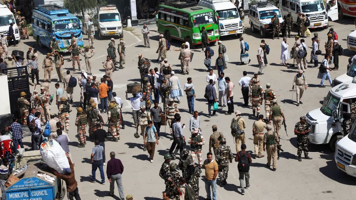 Polling officials with security personnel leave for their respective polling stations on the eve of first phase of the Jammu and Kashmir Assembly election, in Kishtwar district, Tuesday, Sept. 17, 2024.