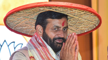 aryana Chief Minister Nayab Singh Saini wearing traditional Assamese Japi greets during his visit to the party state office, at Atal Bihari Vajpayee Bhawan in Guwahati on Oct 14.