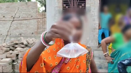 A woman in Bihar showing a plastic bag carrying the alleged illicit liquor, consumption of which has led to several deaths in the last 24 hours.