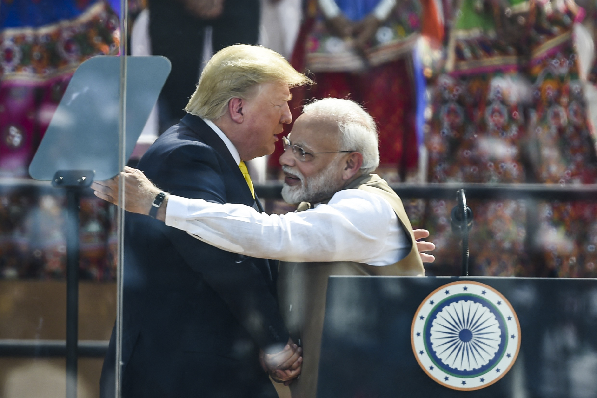 US Prez Donald Trump hugs India's PM Narendra Modi during 'Namaste Trump' rally at Sardar Patel Stadium in Motera, on the outskirts of Ahmedabad, on February 24, 2020.