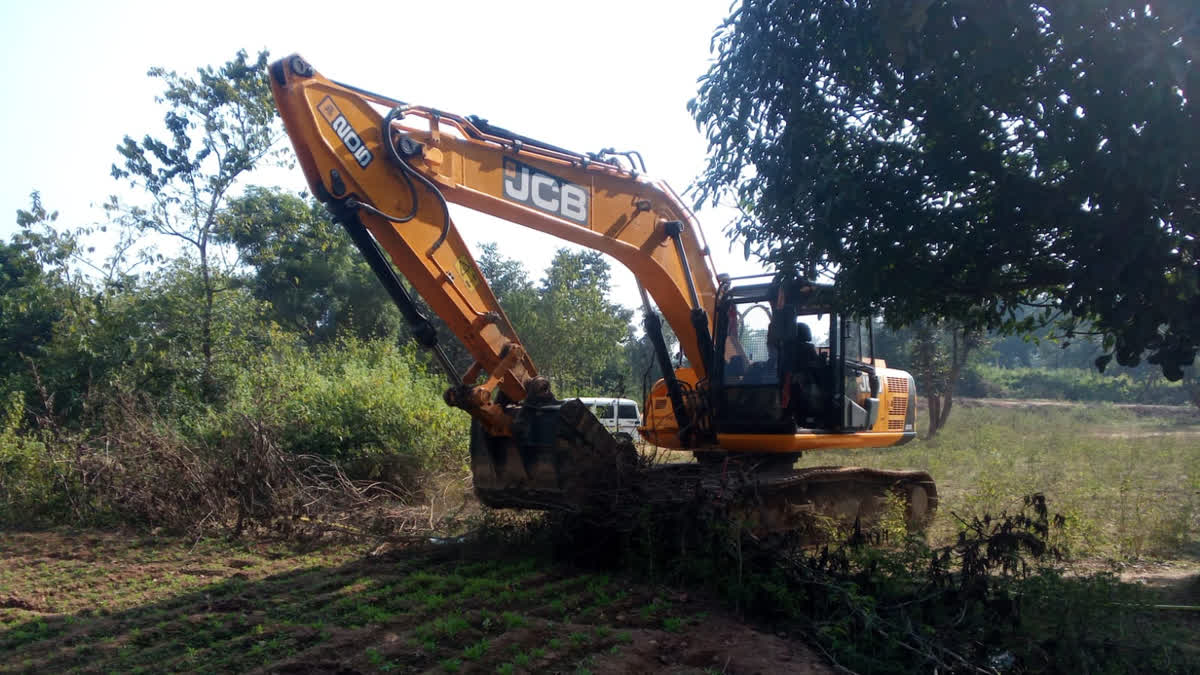 Jharkhand police destroy opium crops with JCB.