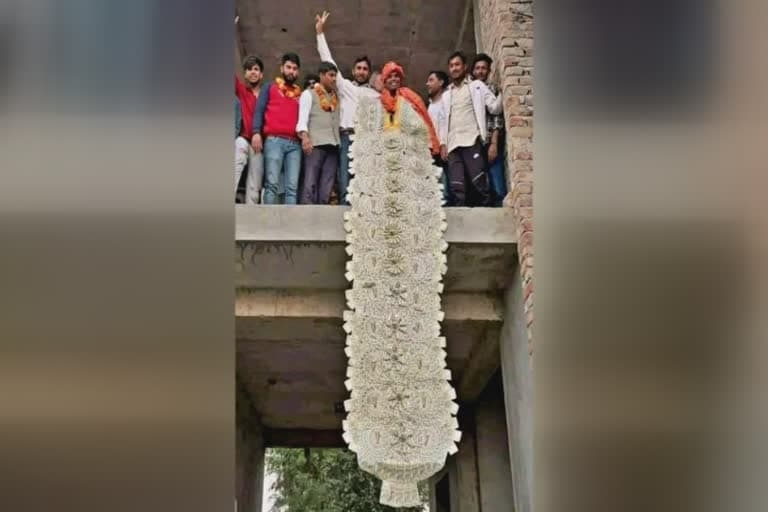 Haryana: Newly elected sarpanch garlanded with Rs 11 lakhs in Faridabad