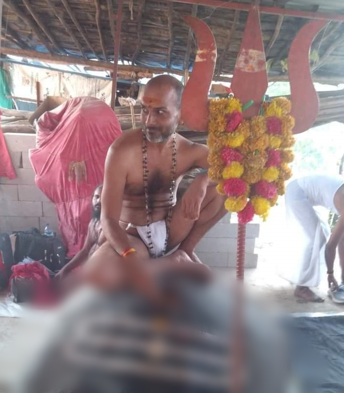 sant bhaiya sarkar sitting on shivling