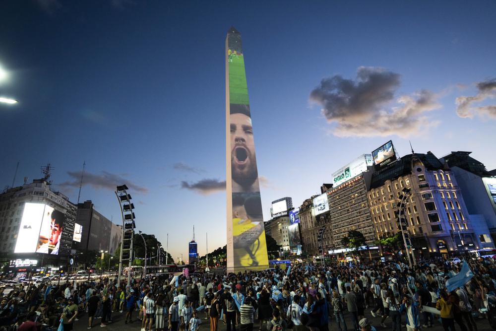 Argentine soccer fans gather at the Obelisk landmark during a rally in support of the national soccer team.