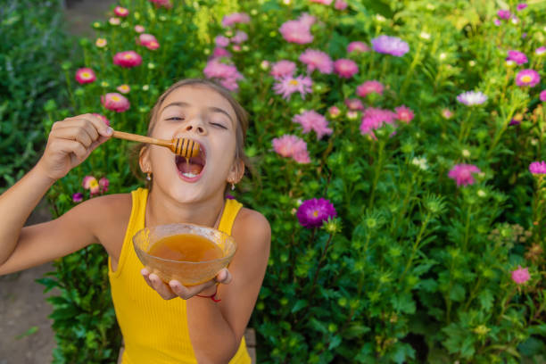 Cute Girl Eating Honey