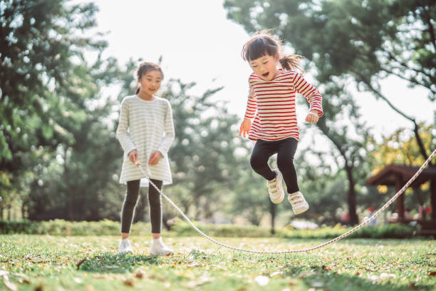 Two girls jumping rope