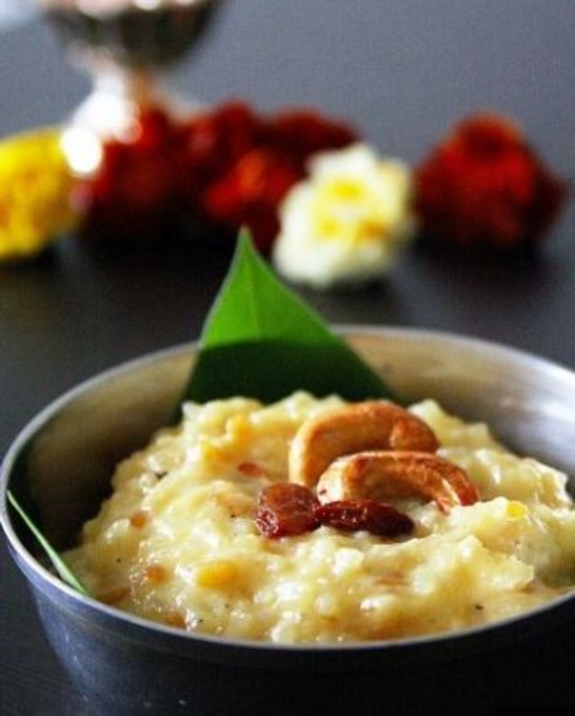 Sakkarai, a sweet Pongal, is prepared for the ceremonial bhog on Thai Pongal's major day. Rice, milk, ghee, and jaggery are used to make a soft dish resembling halwa that is then topped with dry fruits and nuts for crunch. In Tamil, the word 'Pong' means to flow over. Thus, it is customary to simmer this Pongal until it boils and slightly overflows. (ANI)