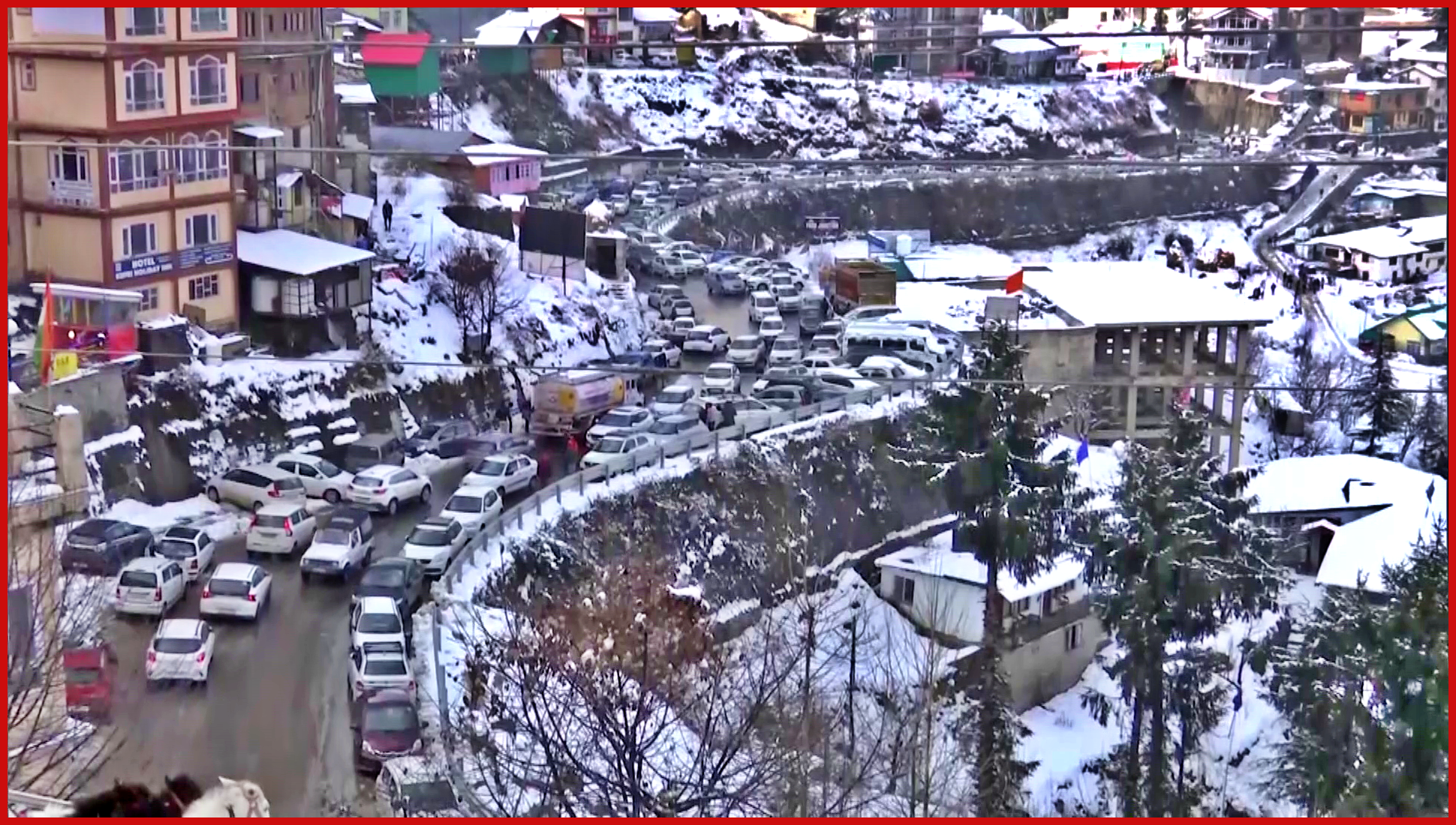 Tourists enjoying snowfall in Kufri