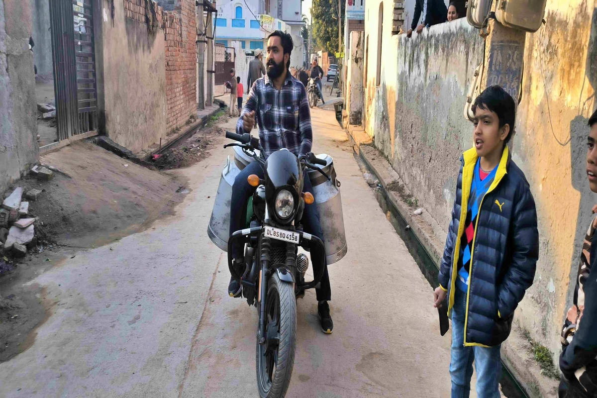 man selling milk on harley davidson bike in faridabad