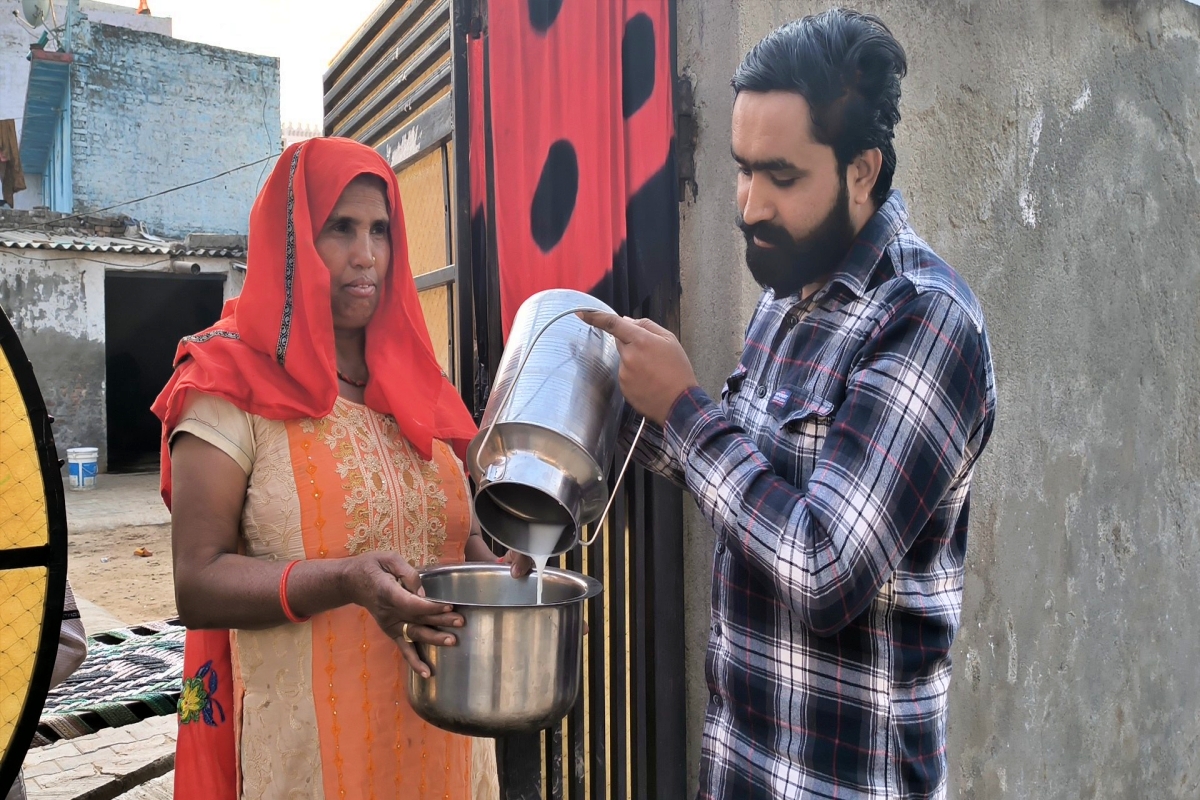 man selling milk on harley davidson bike in faridabad