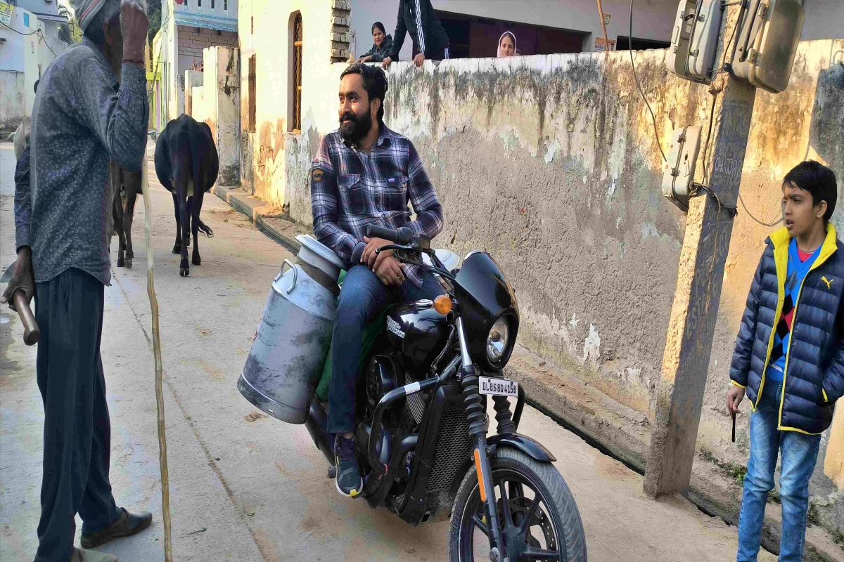 man selling milk on harley davidson bike in faridabad