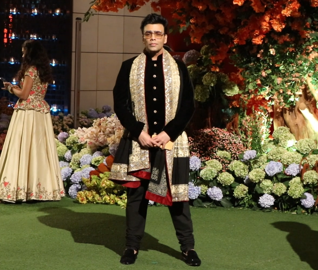 Bollywood ace director and producer, Karan Johar opted for an all-black sherwani with a colourful shawl on his shoulder.