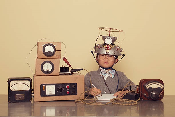 Boy with mind reading helmet