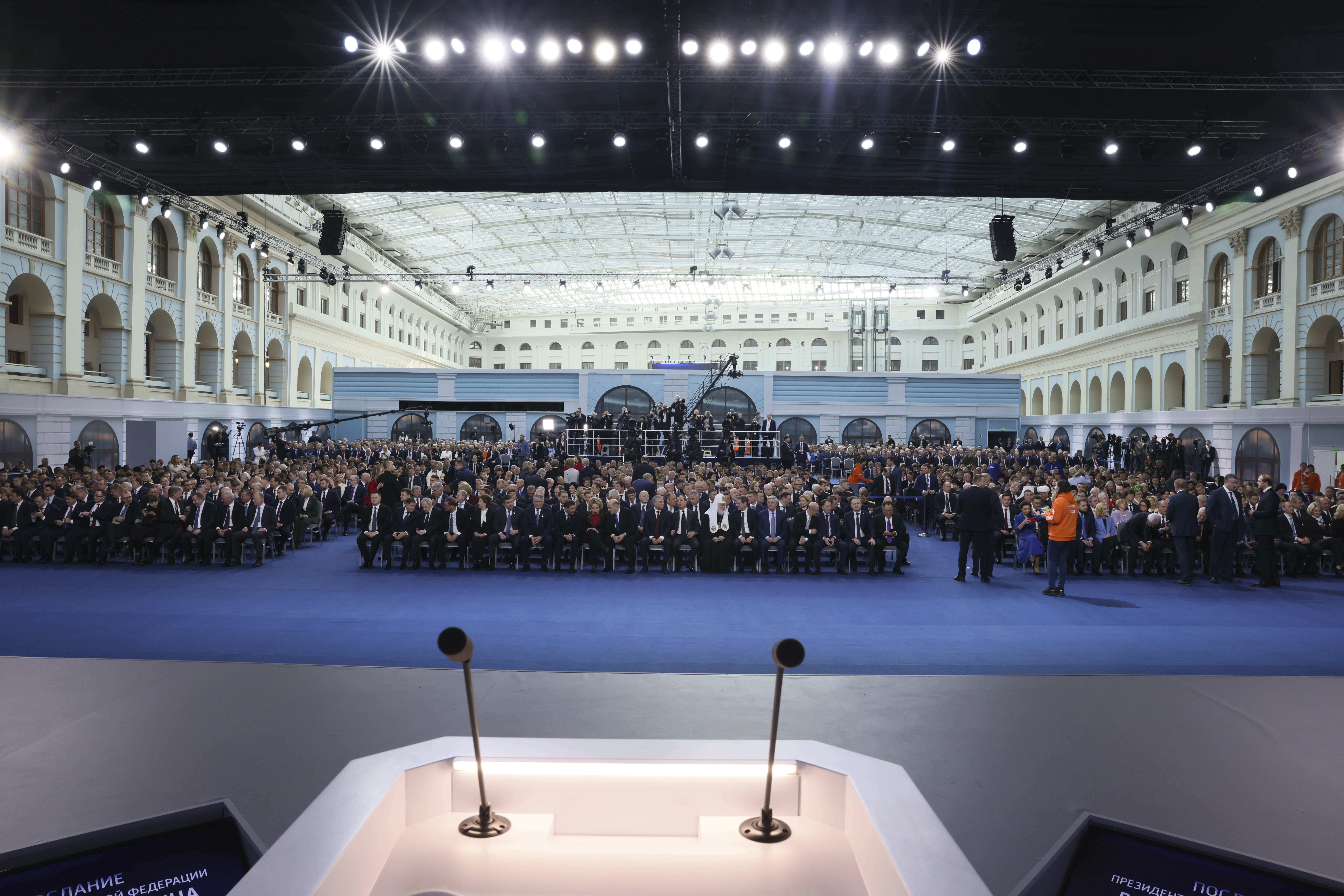 Participants gather to listen Russian President Vladimir Putin's annual state of the nation address in Moscow, Russia, Tuesday (AP Photo)