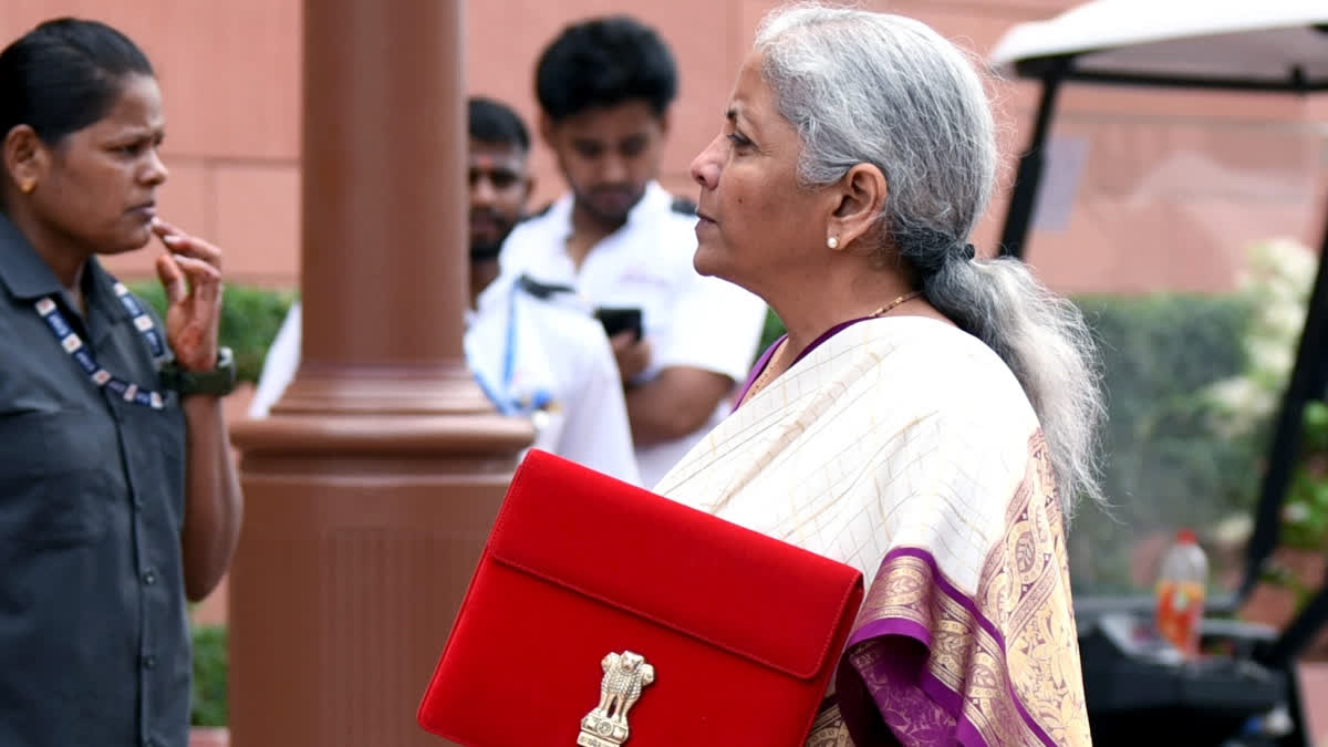 Union Finance Minister Nirmala Sitharaman shows the Budget tablet at the Parliament