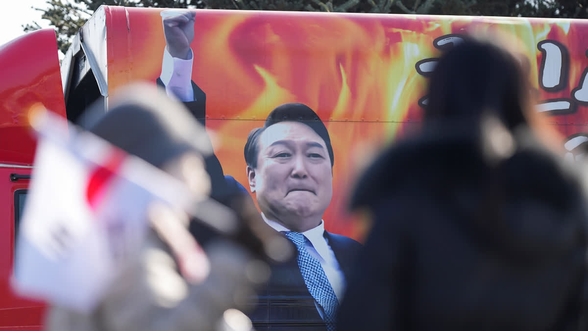 A picture of impeached South Korean President Yoon Suk Yeol is seen on the vehicle during a rally to oppose his impeachment outside of a detention center in Uiwang, South Korea, Friday, Jan. 17, 2025.