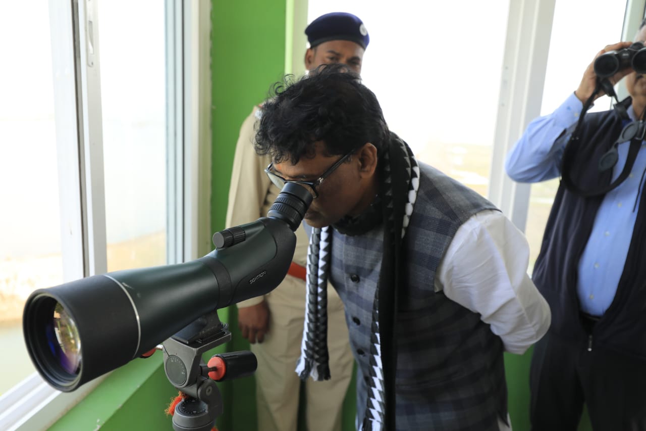 Odisha Forest & Environment Minister Ganesh Ram Singkhuntia at Nalabana to catch a glimpse of migratory birds