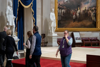 Officials inspect the construction of a stand in the Rotunda, where President-elect Donald Trump is due to take the oath of office on Monday, at the Capitol in Washington, Friday, Jan. 17, 2025.