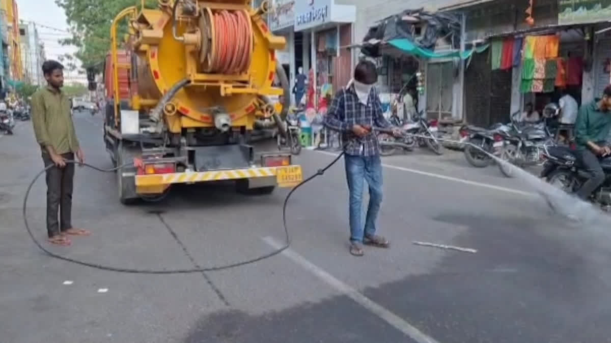 water sprinkled on roads in Barmer