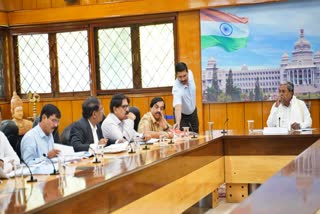 PROGRESS REVIEW MEETING  CM SIDDARAMAIAH  UNUSED GRANTS  BENGALURU