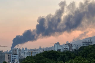 Smoke rises from the building of Iran's state-run television after an Israeli strike in Tehran, Iran, Monday, June 16, 2025.