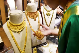 woman looking at jewelry