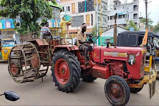 tractor wheels tied to another tractor