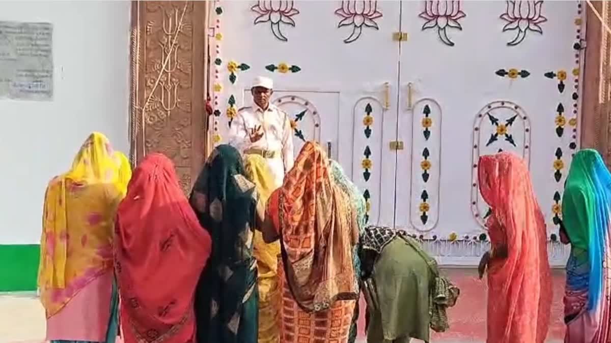 woman devotees wait outside the ashram in Uttar Pradesh's Surajpal alias Narayan Sakar alias Bhole Baba on Thursday, July 18, 2024 Kasganj to have a glimpse of