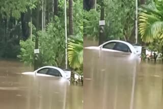 latest malayalam news  rain havoc in kerala  Kannur rain updates  CAR SUBMERGED in rain