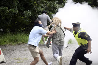 Woman interrupts Quran-burning protest in Sweden by spraying activist with fire extinguisher