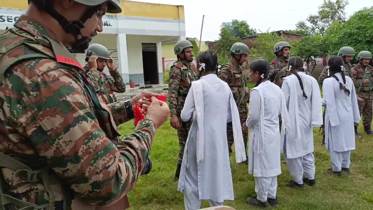 Sisters tie Rakhi's to Army Soldiers