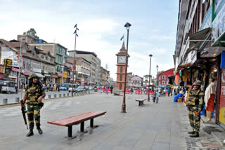 Security forces keep vigil in Srinagar's Lal Chowk area with its famous clocktower in the background.