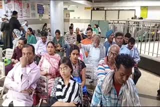 People waiting at a hospital in Ambala