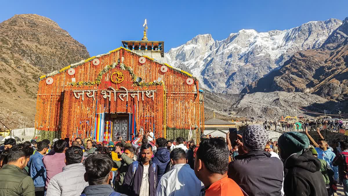 A large number of devotees gather outside the Shri Kedarnath Dham as its portal were closed for the winter season, in Rudraprayag