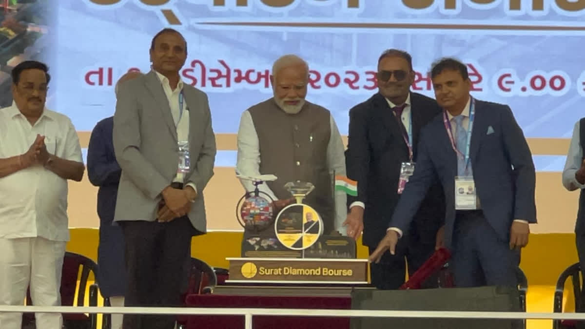 Prime Minister Narendra Modi receives memento with 50-carat diamonds at the inauguration of Surat Diamond Bourse