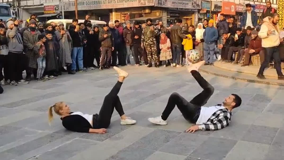 Freestyle footballers Aguska, Patrick display football juggling skills at Lal Chowk in Srinagar