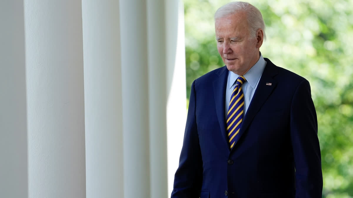 President Joe Biden walks to speak in the Rose Garden of the White House.