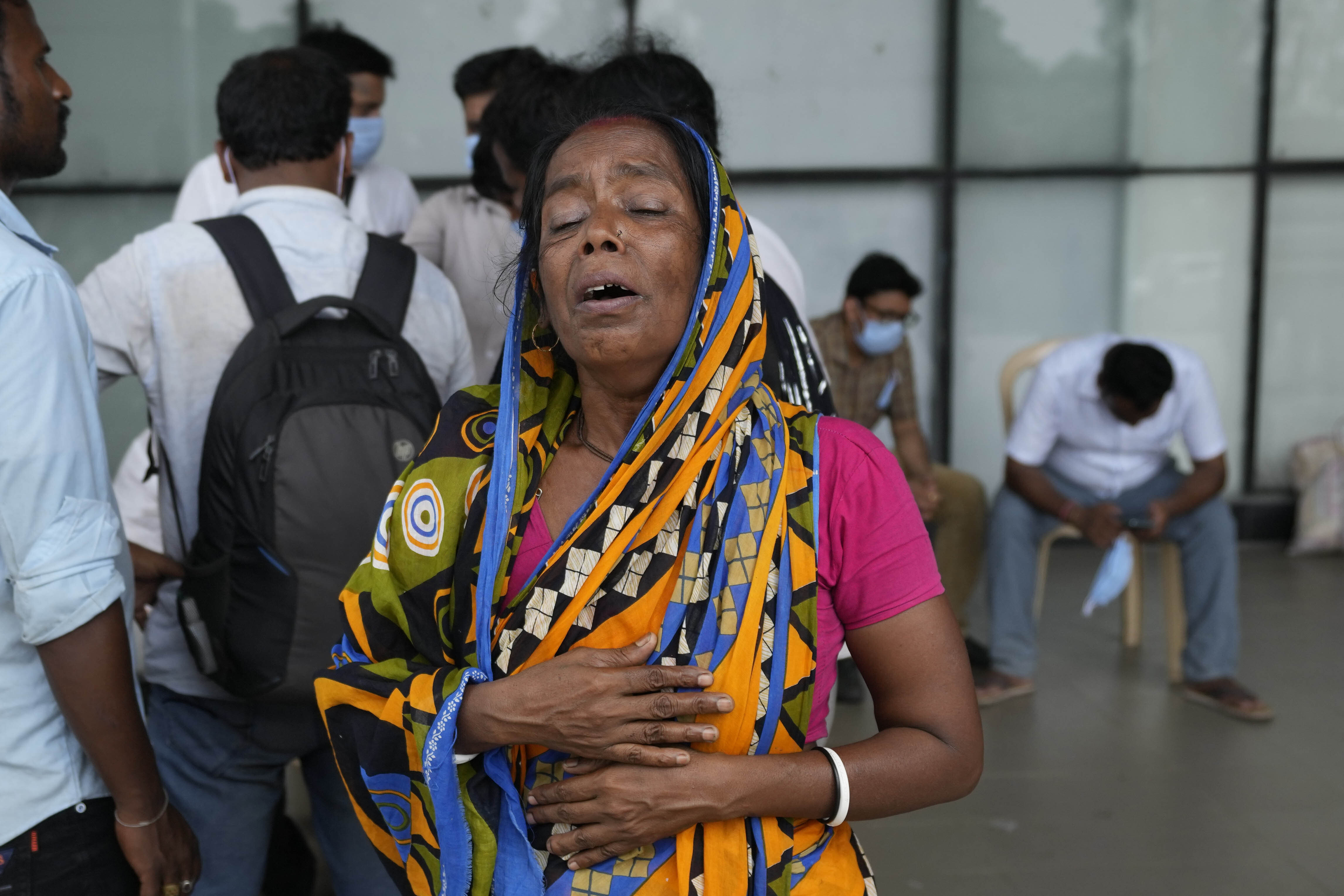 Kanchan Chowdary cries while looking for her husband who was traveling in the train that derailed, in Balasore district (Photo: AP)