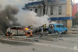 In this photo taken from video released by Russia Emergency Situations Ministry telegram channel on Dec. 30, 2023, firefighters extinguish burning cars after shelling in Belgorod, Russia. Belgorod has canceled its traditional Orthodox Epiphany festivities on Friday, Jan. 19, 2024 due to the threat of attacks as Kyiv's forces pursue a new strategy with the war approaching its two-year milestone. (Russia Emergency Situations Ministry telegram channel via  (AP)