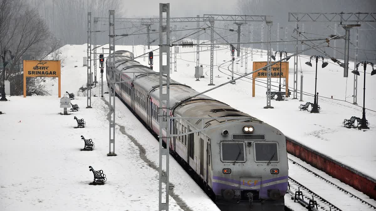 A train treads on the snow-covered tracks on the Baramulla-Banihal route in Kashmir