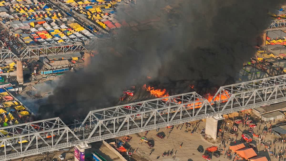 In this drone shot, smoke billows out after a fire broke out in tents during Mahakumbh, at Sangam in Prayagraj, Sunday, Jan. 19, 2025.