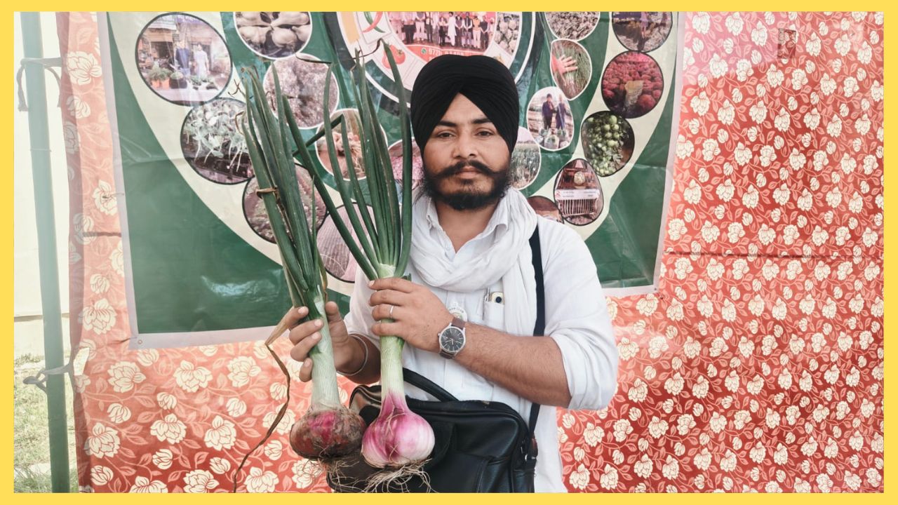 A farmer showcases giant onions at agricultural fair in Hisar, Haryana