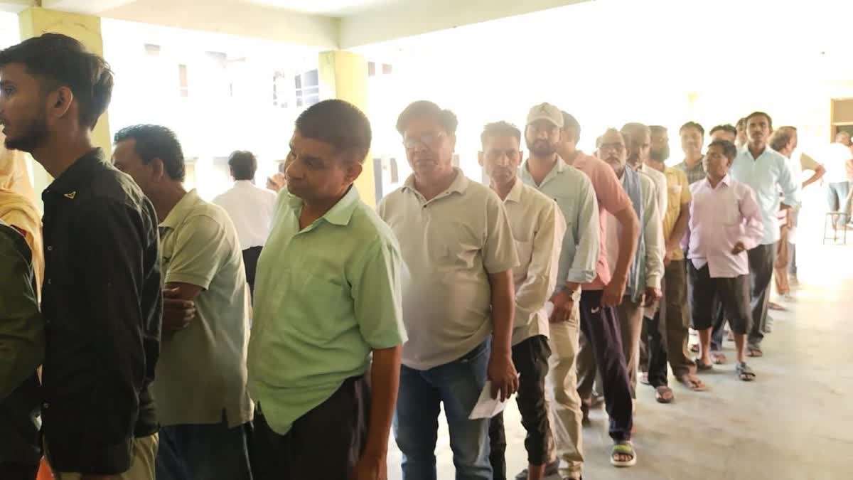 Voters queue up outside polling station in Rajasthan during Lok Sabha election phase 1