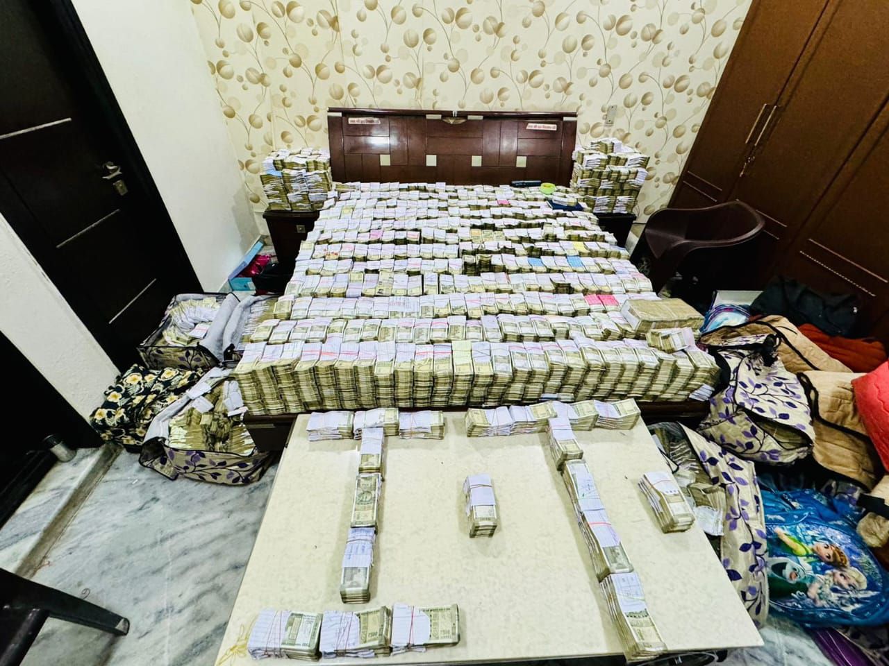 Rs 60 crore cash found in IT raid on shoe traders premises in Agra