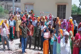Tasing residents protesting at the water supply department office in Behror